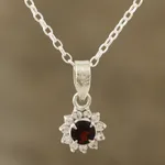 Garnet pendant necklace, 'Gleaming Flower' - Floral Garnet Pendant Necklace from India