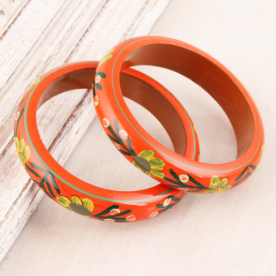 Wood bangle bracelets, 'Vermilion Garden' (pair) - Floral Haldu Wood Bangle Bracelets in Vermilion (Pair)