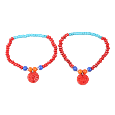 Wood beaded stretch bracelets, 'Energetic Colors' (pair) - Colorful Wood Beaded Stretch Bracelets (Pair)