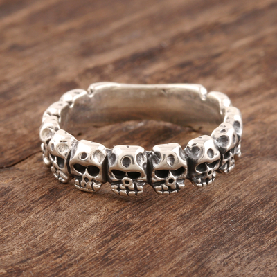 Sterling silver band ring, 'Row of Skulls' - Sterling Silver Skull Band Ring from India