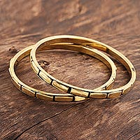 Brass bangle bracelets, 'Delightful Procession' (pair) - Patterned Brass Bangle Bracelets from India (Pair)