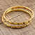 Brass bangle bracelets, 'Delightful Procession' (pair) - Patterned Brass Bangle Bracelets from India (Pair) (image 2b) thumbail
