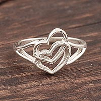 Sterling silver band ring, 'Hearts United' - Romance-Themed Sterling Silver Heart Band Ring from India