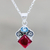 Garnet and blue topaz pendant necklace, 'Rainbow Fragments' - Artisan Crafted Garnet and Blue Topaz Pendant Necklace