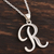 Anhänger-Halskette aus Sterlingsilber, 'Dancing R - Handwerklich gefertigte R Initialen-Halskette aus Indien