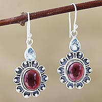 Garnet and blue topaz dangle earrings, 'Winning Combination' - Oxidized Flower Earrings with Garnet and Blue Topaz