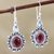 Garnet and blue topaz dangle earrings, 'Winning Combination' - Oxidized Flower Earrings with Garnet and Blue Topaz thumbail