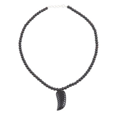 Ebony wood pendant necklace, 'Majestic Leaf' - Handcrafted Ebony Wood Pendant Necklace with Leaf Motif