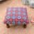 Upholstered ottoman foot stool, 'Creative Beauty' - Multicolored Ottoman with Wood Legs (image 2b) thumbail