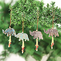 Wood ornaments, 'Elephant Celebration' (set of 4) - 4 Mango Wood Elephant Ornaments with Beaded Tassels
