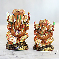 Gold-accented wood statuettes, 'Imperial Ganesha' (pair)