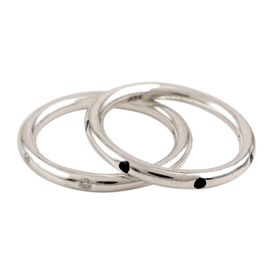 Cubic zirconia band rings, 'Flipped' (pair) - Cubic Zirconia and Sterling Silver Band Rings (Pair)