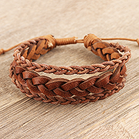 Leather wristband bracelet, 'Braided Charm' - Unisex Braided Leather Wristband Bracelet