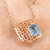 Rose gold-plated blue topaz pendant necklace, 'Open Plaza in Rose Gold' - Blue Topaz and Rose Gold-Plated Pendant Necklace