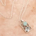 Larimar and blue topaz pendant necklace, 'Sweet Companions' - Larimar and Blue Topaz Pendant Necklace from India