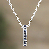 Blue sapphire pendant necklace, 'Circle of Love' - Artisan Crafted Blue Sapphire Rhodium Plated Silver Necklace