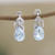 Rhodium-plated blue topaz and cubic zirconia drop earrings, 'Free People in Blue' - Rhodium-Plated Blue Topaz Drop Earrings (image 2) thumbail