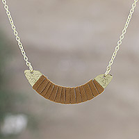 Suede pendant necklace, 'Caramel Crescent Amulet' - Brass and Suede Pendant Necklace with Caramel Tone
