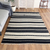Wool area rug, 'Ivory Lines' (5x8) - Handloomed Striped Wool Area Rug in Ivory and Black (5x8)