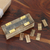 Wood and brass domino set, 'Amusing Weekend' - Hand-Carved Mango Wood Domino Set with Brass Accents thumbail
