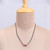Ceramic pendant necklace, 'Red Vines' - Hand-Painted Ceramic Pendant Necklace with Leather Cord
