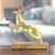 Wood sculpture, 'Reindeer Dream' - Hand-Carved Mango Wood Reindeer Sculpture with Yellow Tones