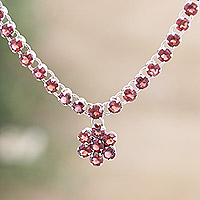 Rhodium-plated garnet pendant necklace, 'Passionate Soul' - Rhodium-Plated Floral Pendant Necklace with Garnet Stones