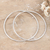 Sterling silver hoop earrings, 'Stylish Halo' - Polished Sterling Silver Hoop Earrings from India