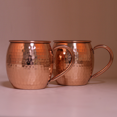 Copper beer mugs, 'Royal Celebration' (pair) - Pair of Handcrafted Copper Beer Mugs with Hammered Finish