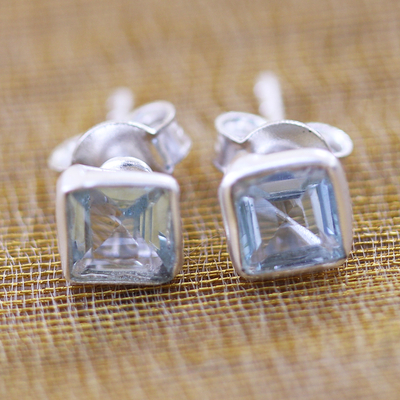 Blue topaz stud earrings, 'Subtle Glimmer' - Sterling Silver Stud Earrings with Blue Topaz Gemstone