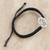 Cubic zirconia macrame pendant bracelet, 'Bonds of Divinity' - Black Macrame Cord Bracelet with Ek Onkar Pendant and Gems