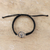 Macrame sterling silver pendant bracelet, 'Altar to Power' - Black Macrame Cord Bracelet with Sterling Silver Fist Symbol