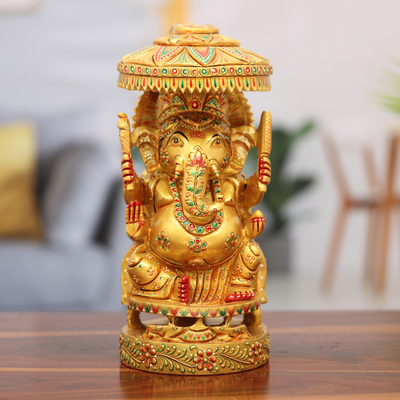 Wood sculpture, 'Ganesha's Parasol' - Hand-Painted Traditional Ganesha Sculpture Crafted in India