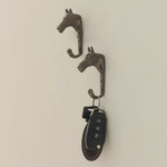 Brass wall hooks, 'Regal Horse' (pair) - Antiqued Finished Horse-Shaped Brass Wall Hooks from India