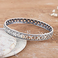 Sterling silver bangle bracelet, 'Primaveral Beauty' - Polished Flower-Themed Sterling Silver Bangle Bracelet