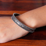 Sterling silver bangle bracelet, 'Flourishing Beauty' - Flower and Leaf-Themed Sterling Silver Bangle Bracelet