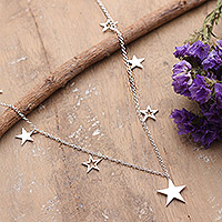 Sterling silver charm necklace, 'Starry Desires' - High-Polished Star-Themed Sterling Silver Charm Necklace