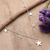 Sterling silver charm necklace, 'Starry Desires' - High-Polished Star-Themed Sterling Silver Charm Necklace (image 2) thumbail