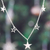 Sterling silver charm necklace, 'Starry Desires' - High-Polished Star-Themed Sterling Silver Charm Necklace (image 2b) thumbail
