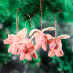 Wool felt ornaments, 'Flying Piggies' (set of 4) - Set of 4 Handcrafted Wool Felt Pig Ornaments from India