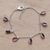 Garnet charm bracelet, 'Dancing Devotion' - Sterling Silver Charm Bracelet with 7-Carat Garnet Jewels