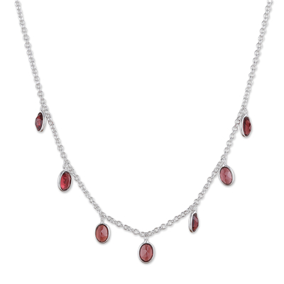 Garnet charm necklace, 'Dancing Devotion' - Sterling Silver Charm Necklace with 7-Carat Garnet Jewels