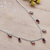 Garnet charm necklace, 'Dancing Devotion' - Sterling Silver Charm Necklace with 7-Carat Garnet Jewels