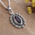 Garnet pendant necklace, 'Radiant Passion' - Peacock-Inspired Natural One-Carat Garnet Pendant Necklace