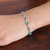 Onyx link bracelet, 'Savant Rain' - 9-Carat Faceted Green Onyx Link Bracelet Crafted in India