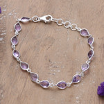 Amethyst link bracelet, 'Sagacity Rain' - 9-Carat Faceted Amethyst Link Bracelet Crafted in India