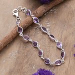 Amethyst link bracelet, 'Sagacity Rain' - 9-Carat Faceted Amethyst Link Bracelet Crafted in India