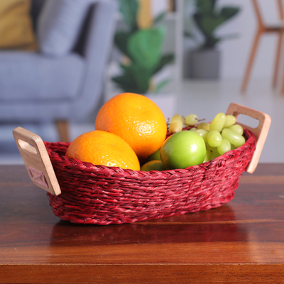 Natural fiber basket, 'Romantic Essentials' - Handwoven Red Sabai Grass Fiber Basket with Wood Handles
