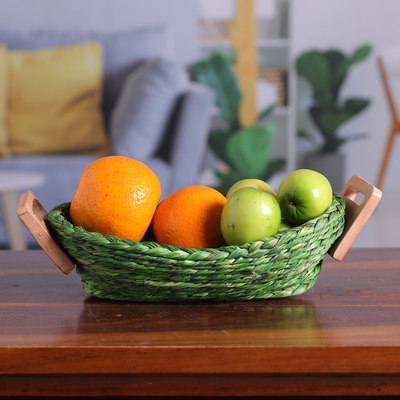 Natural fiber basket, 'Harmonious Essentials' - Handwoven Green Sabai Grass Fiber Basket with Wood Handles