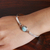 Larimar bangle bracelet, 'Heaven's Moon' - Polished Minimalist Sterling Silver Larimar Bangle Bracelet